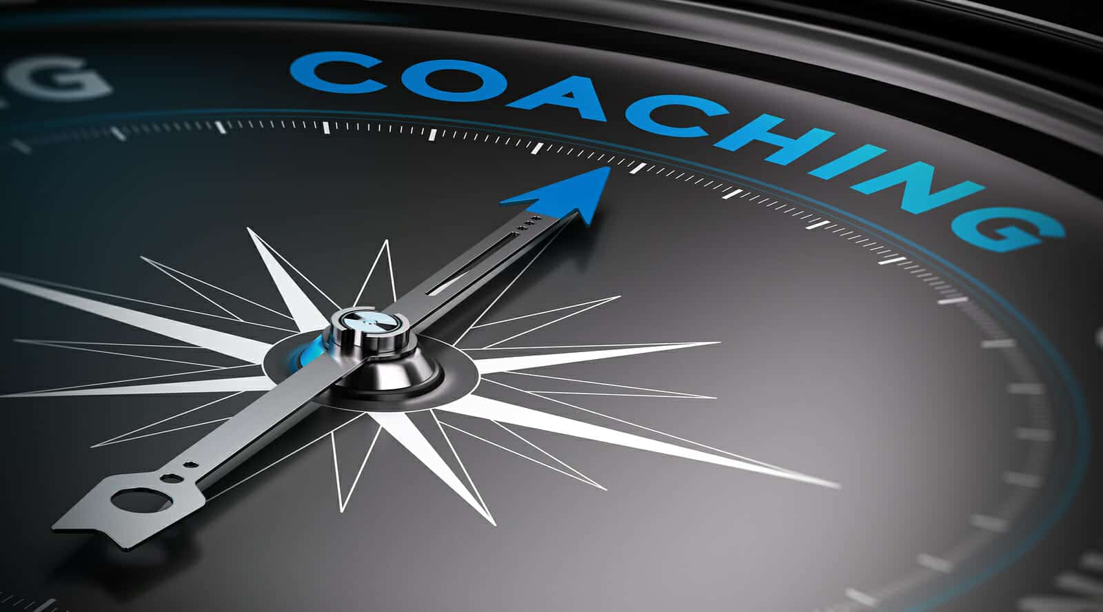 Close up of compass pointing to the word "coaching" (Also means divorce coaching here.)