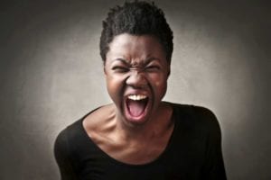 Angry African American woman screaming. Angry wife.
