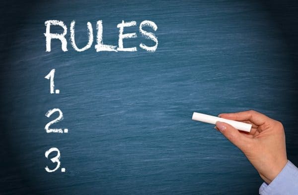 Hand with chalk writing "Rules" on a chalkboard. What are the rules of a trial separation?