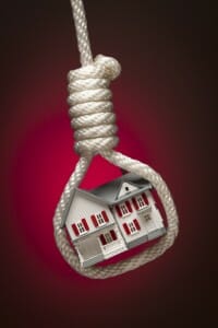 Keeping the house in a divorce is not always a good idea Toy house hanging in a noose: keeping the house in a divorce isn't always good.