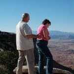 Upset senior couple arguing on a hike in the desert