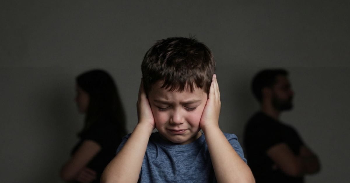 AI image of a young child with his hands over his ears, looking sad. Behind him, his parents are facing away from each other with their arms crossed.