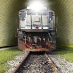 Close up of a train coming through a tunnel right at you