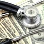 Stethoscope on a stack of money