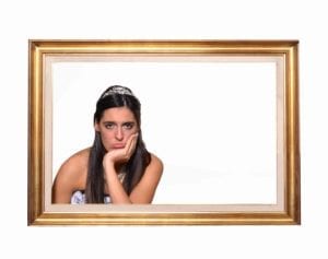 Sad bride in an empty picture frame.