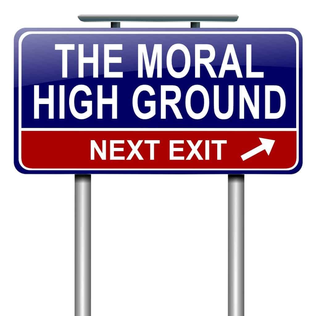 Red and Blue Road sign saying: "The Moral High Ground: Next Exit."