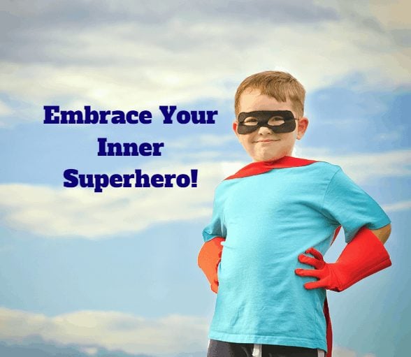 Proud young boy in superhero costume with words: "Embrace Your Inner Superhero!"