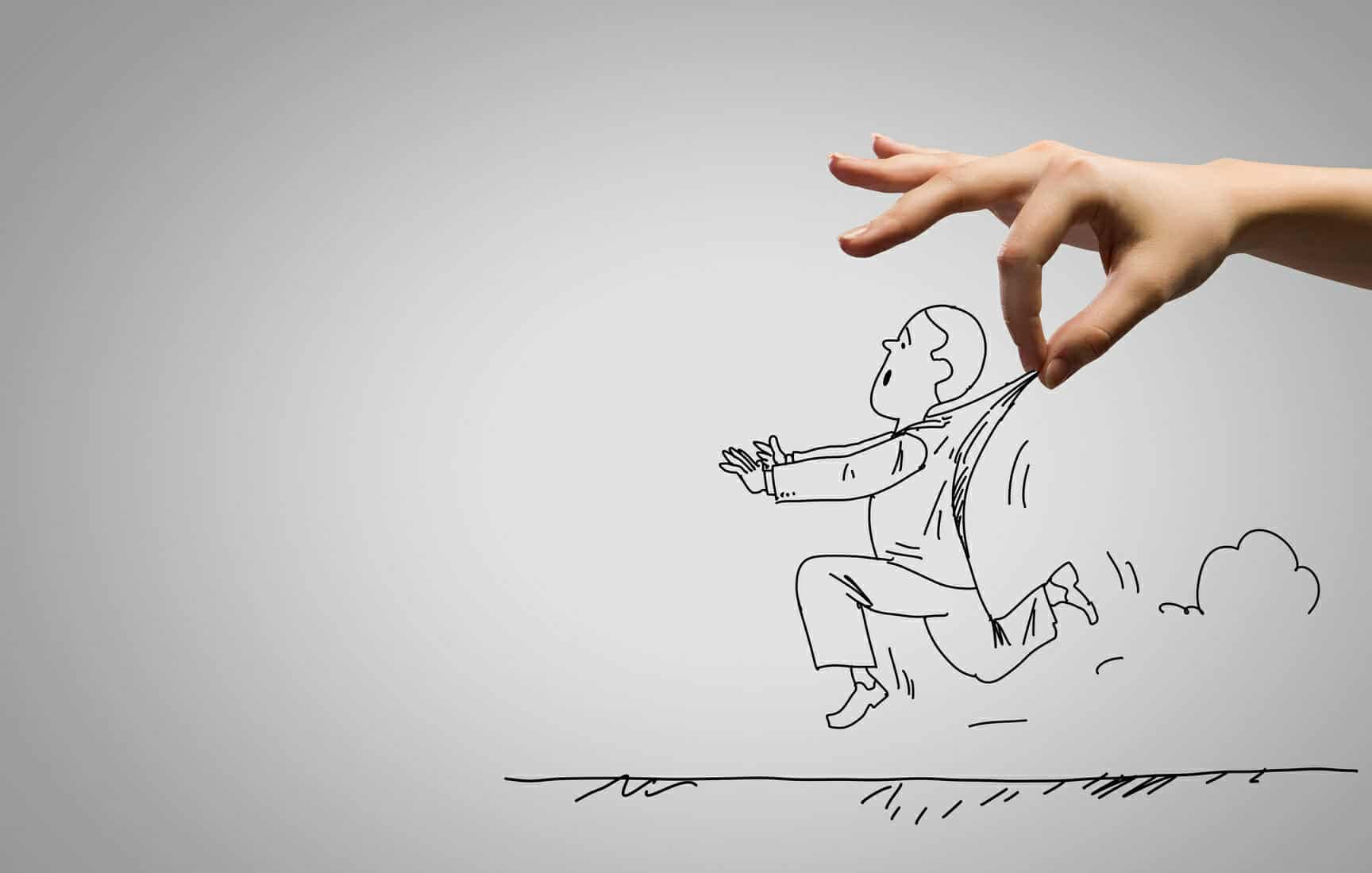 Hand holding a cartoon drawing of a man trying to run away.