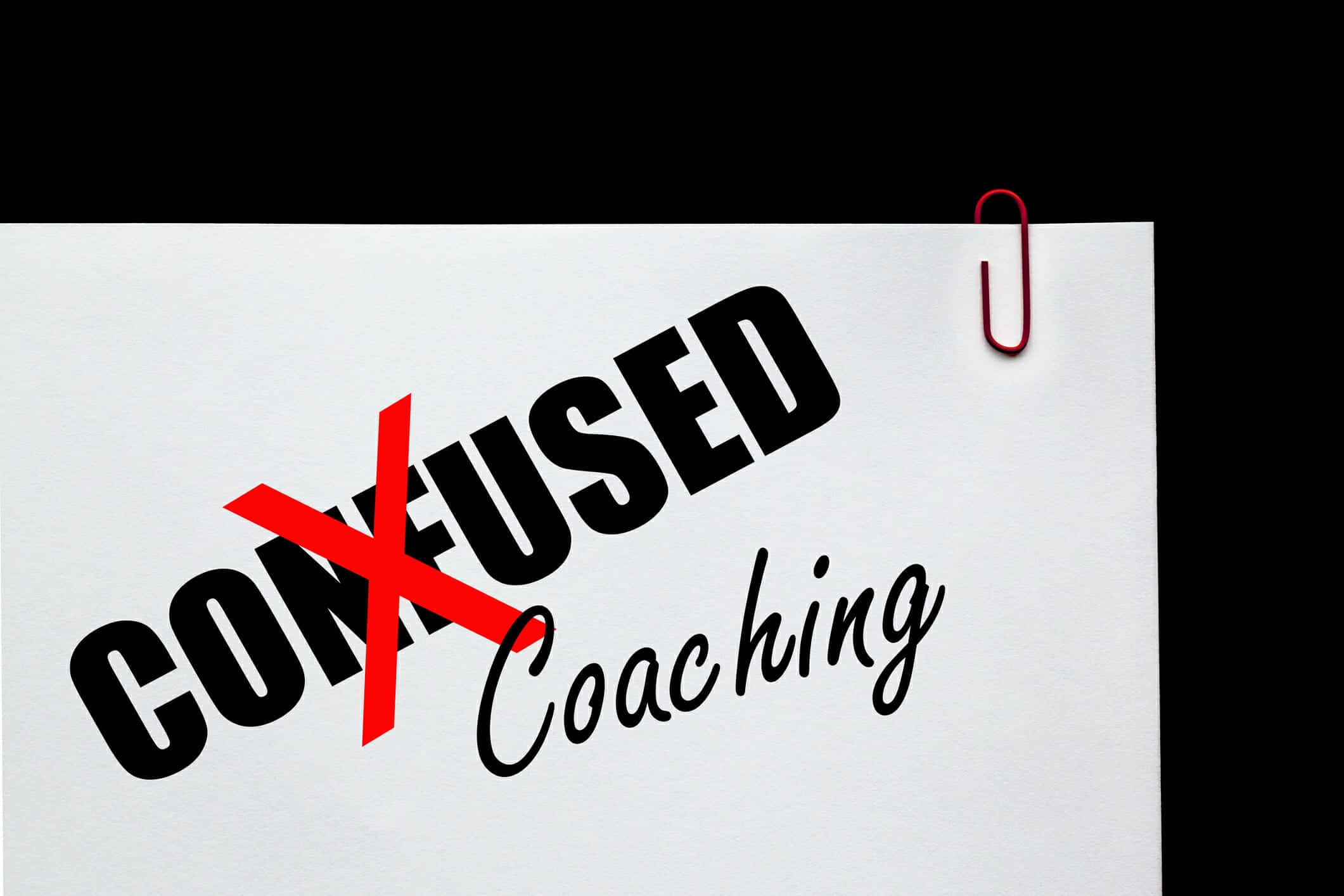 Word "Confused" with a red "X" on it, and the word "Coaching" written below
