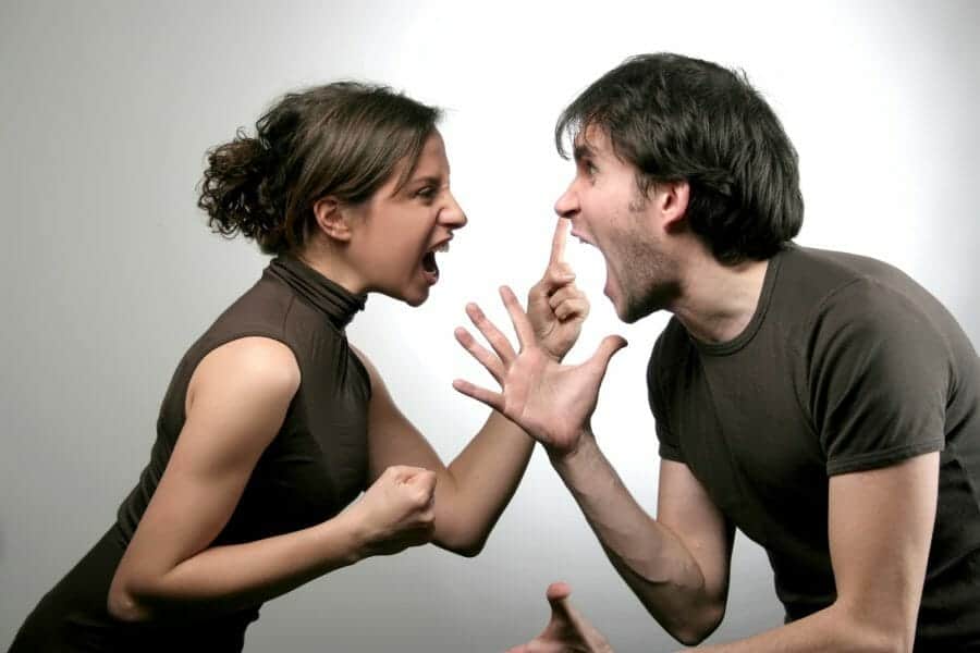 Young couple screaming in each other's faces.