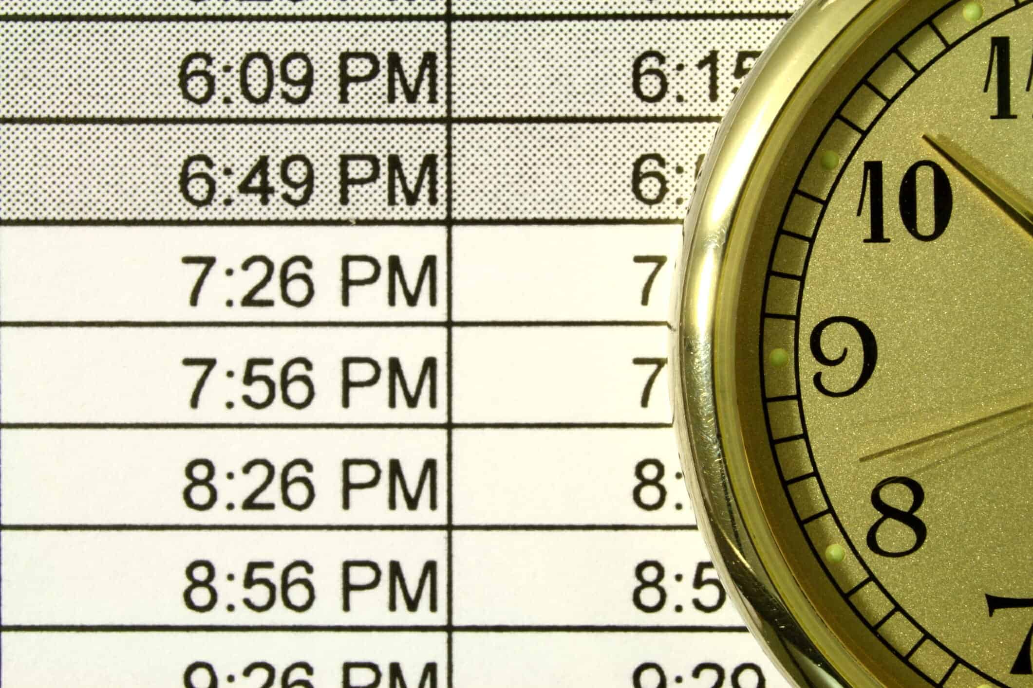 Clock next to schedule of times.