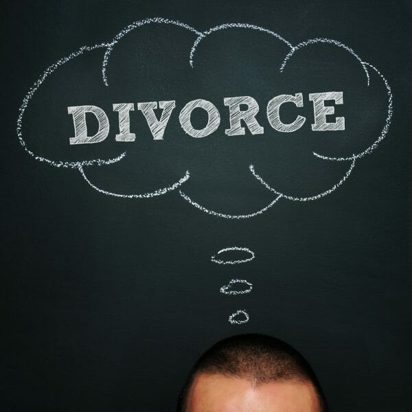 a man over chalkboard with a thought bubble drawn in it and the word divorce