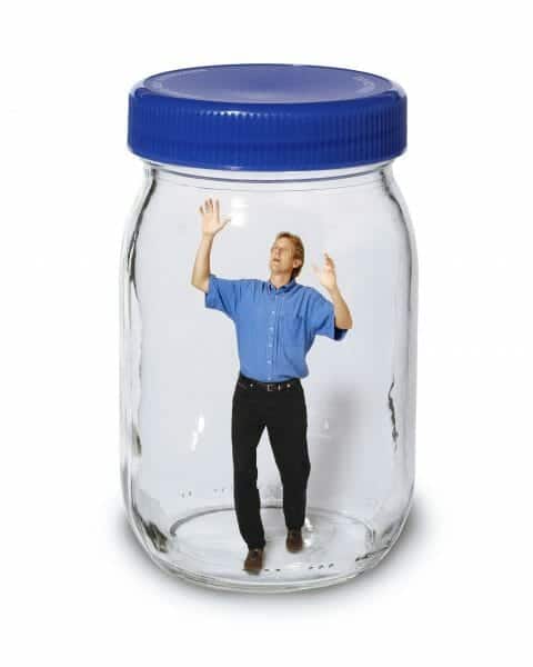 Small man trapped in a big mason jar.