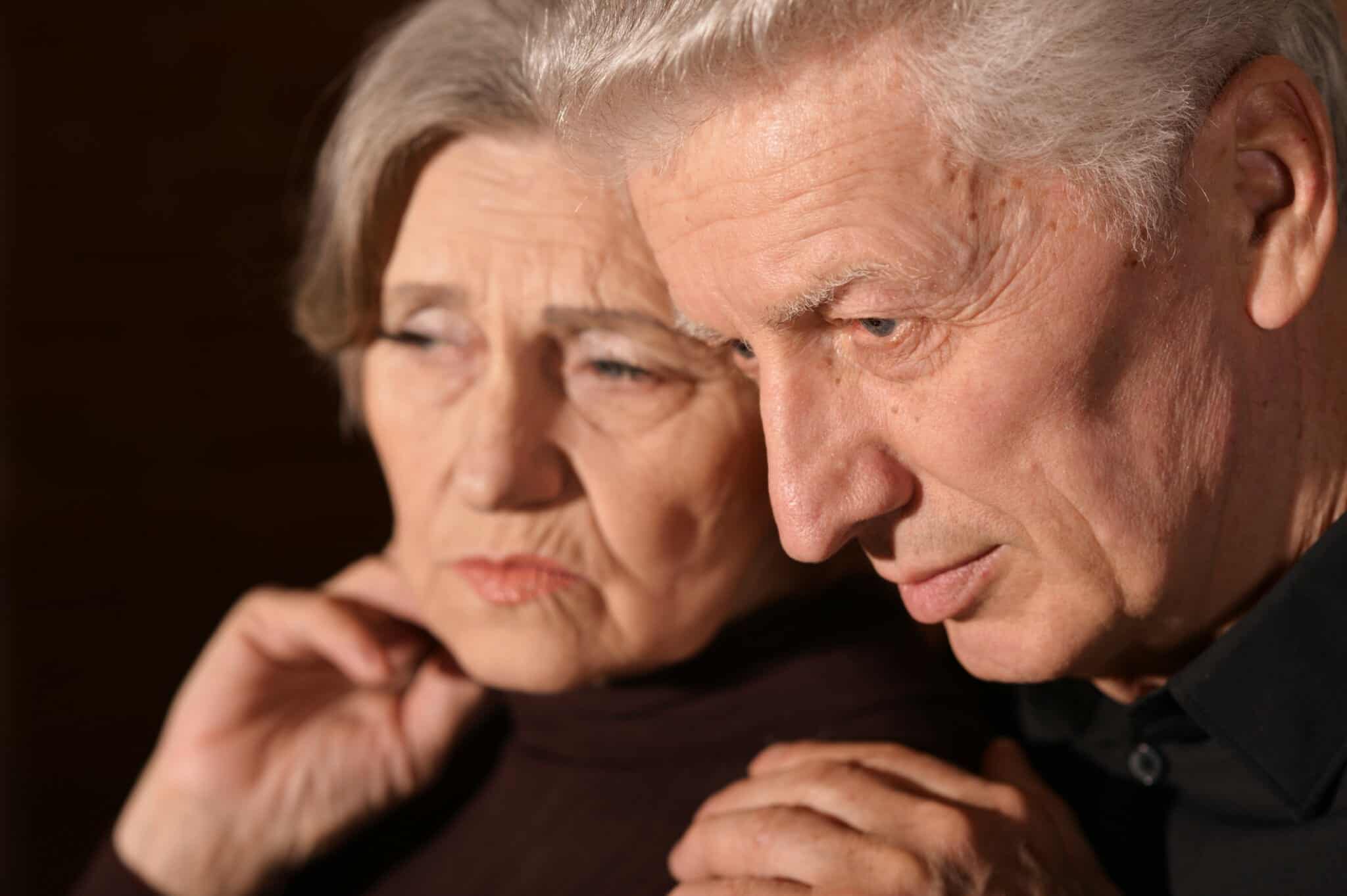 Close up of older couple contemplating divorce after 50