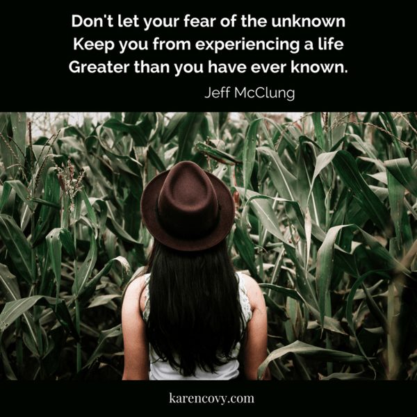 Woman standing in front of a cornfield, looking in, with saying, "Don't let the fear of the unknown keep you from experiencing a life greater than you have ever known."