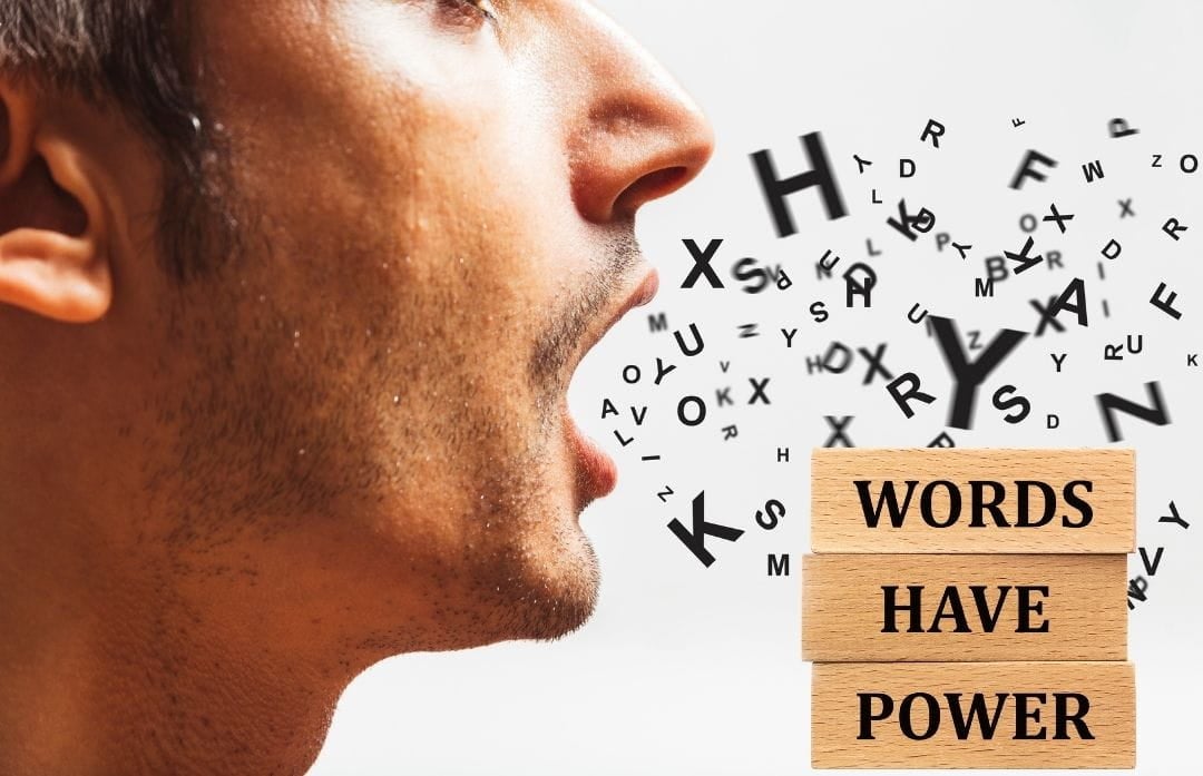 Sideways profile of a man with letters coming out of his open mouth. Beside is the phrase "Words have power"