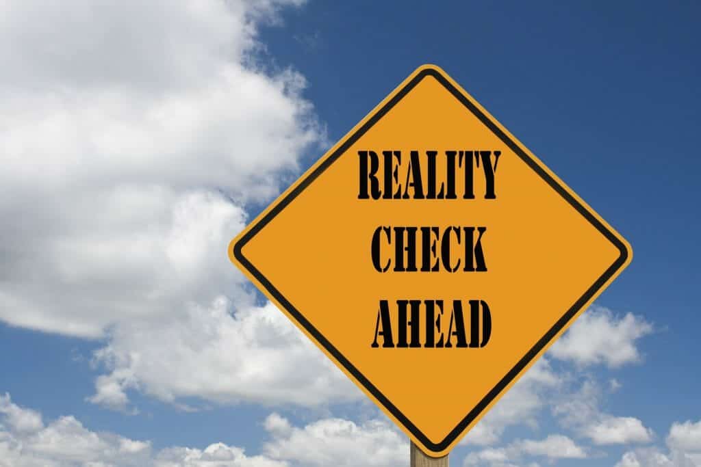 Yellow Caution Sign Saying, "Reality Check Ahead."