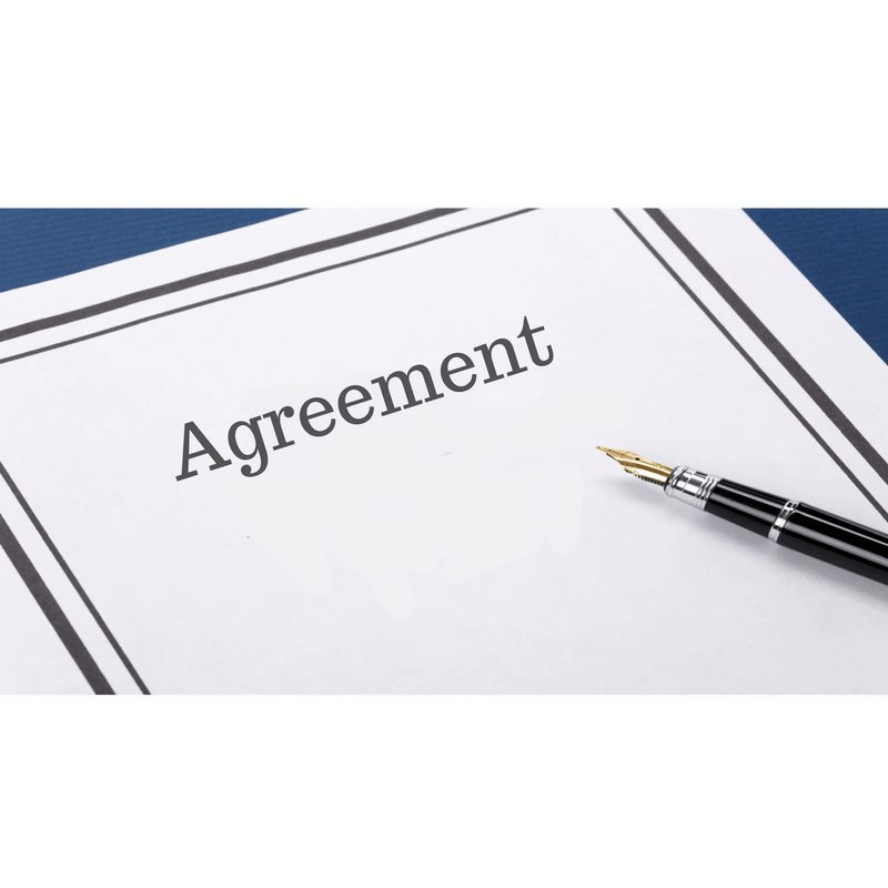 Agreement with a pen resting on it