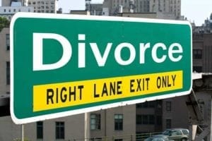 Green road sign saying "Divorce: Right Lane Exit Only" Your divorce is final.