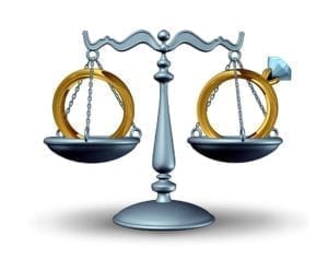 Cartoon image of husband and wife's wedding ring on the scales of justice