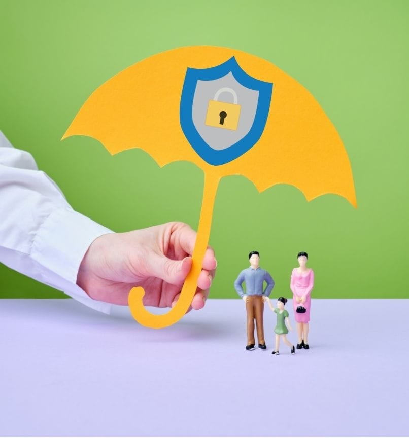 miniature family dolls shielded by an umbrella with a security sign symbolizing life insurance as security