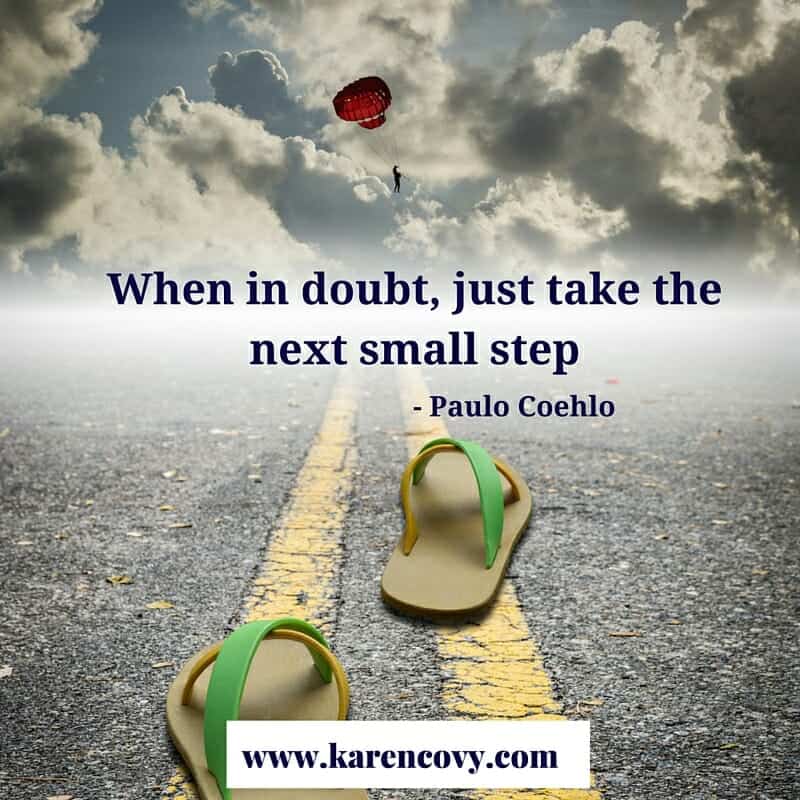 Empty sandals on a road with the saying, "When in doubt, just take the next small step."