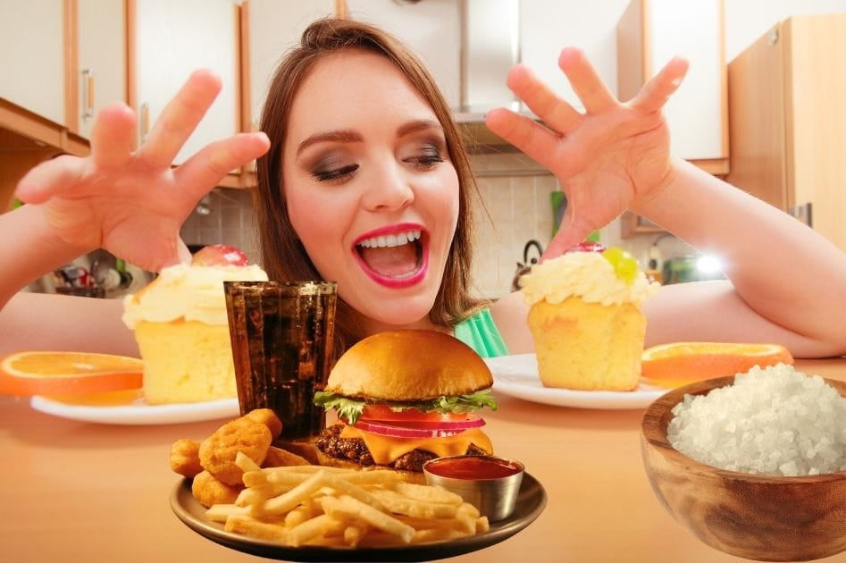A woman who cant wait to eat all the food on the table