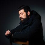 Sad man in a blue parka thinking about preparing for divorce