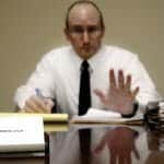 Divorce lawyer holding out his hand: surviving a divorce deposition