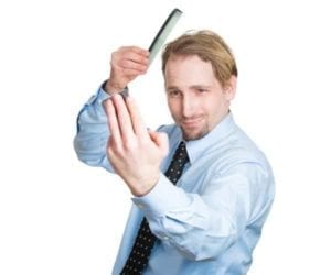 Narcissistic Man Combing His Hair And Gazing Into A Mirror How To Win When Divorcing