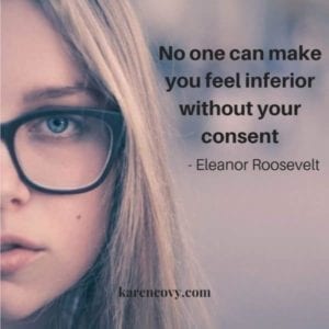 Pretty young woman with glasses looking at camera with quote: No one can make you feel inferior without your consent.