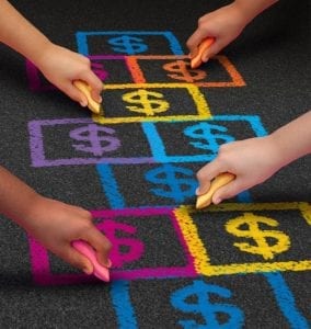Children drawing chalk hopscotch board with dollar signs in it signifying child support modification.
