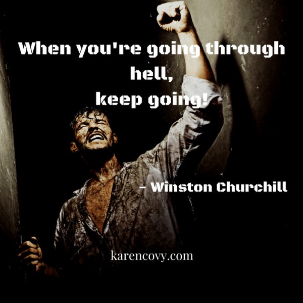 Dirty man fighting his way out of a tunnel with the saying: "When You're Going Through Hell, Keep Going."