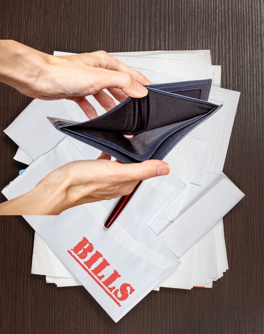 bills piling up Bills piling up on the table while a pair of hands open an empty wallet