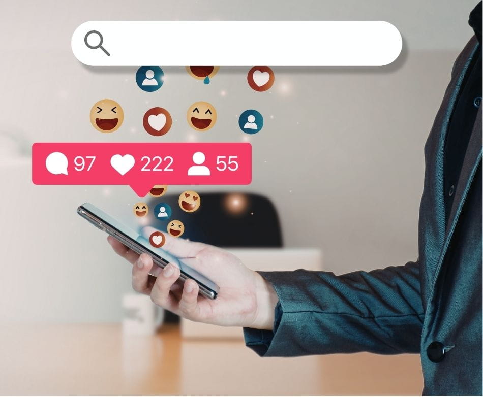 social media A hand holding a phone, with social media reacts flooding the screen. A search bar is on the top of the photo