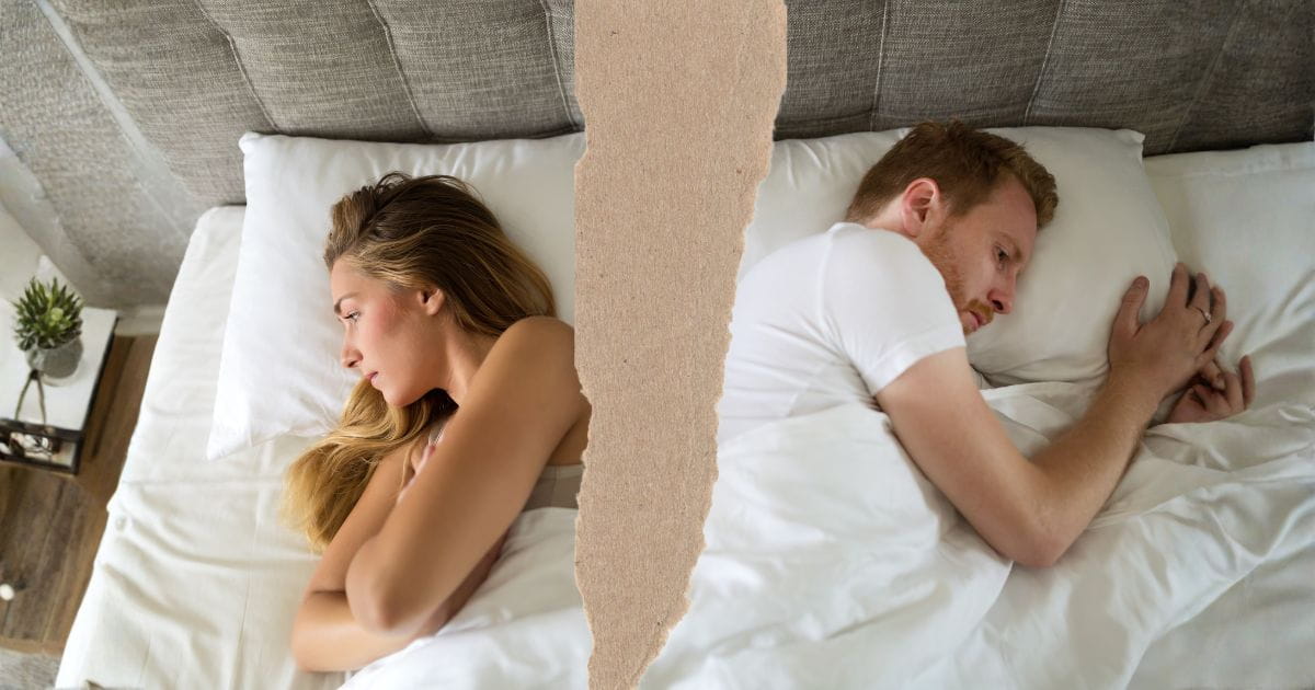 couple with infidelity problem photo torn in the middle of a couple turning on each other's backs in bed