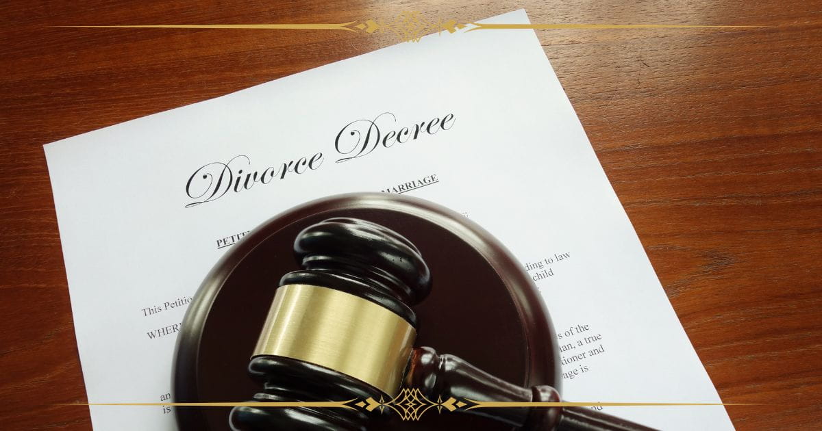 divorce decree A printed divorce decree document below a judge's gavel