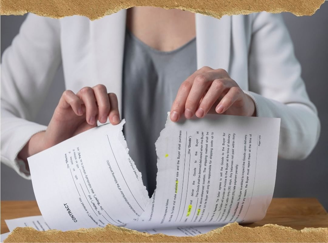 a woman tearing a contract