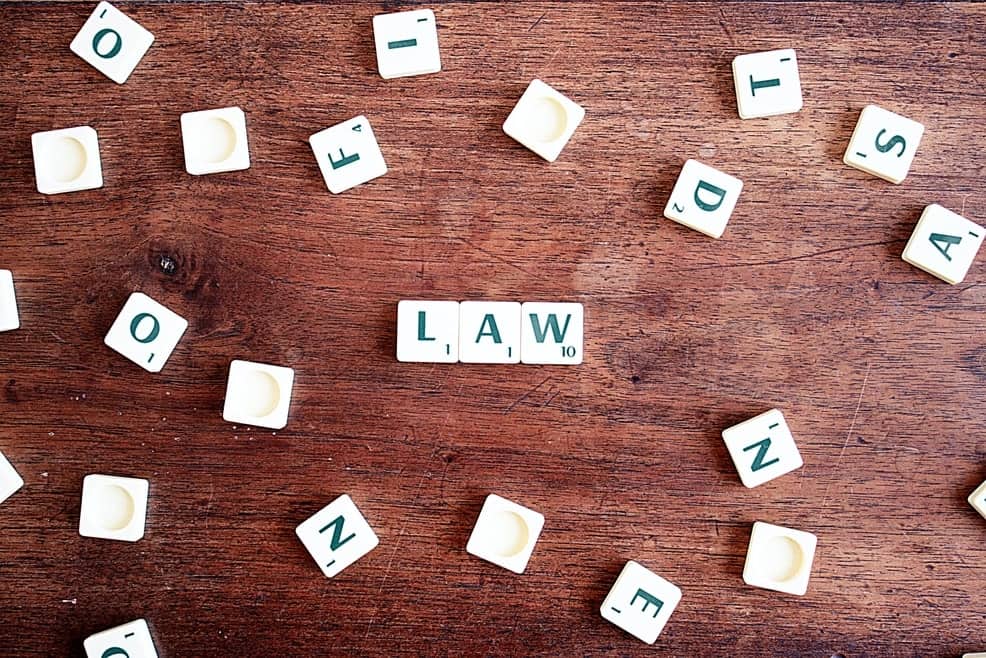 Scattered Scrabble Letter spelling "Law" and signifying here the Universal Laws of Divorce.