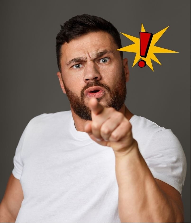 man angrily pointing his finger to the viewer, in an act of blame