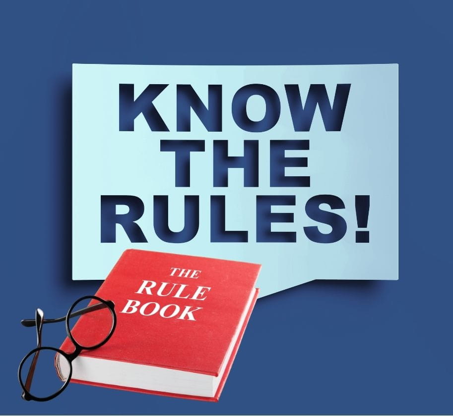 A sign saying know the rules, and a rule book beside it