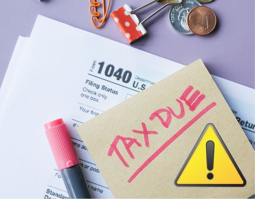 tax documents under a written note saying "Tax Due". divorce and taxes