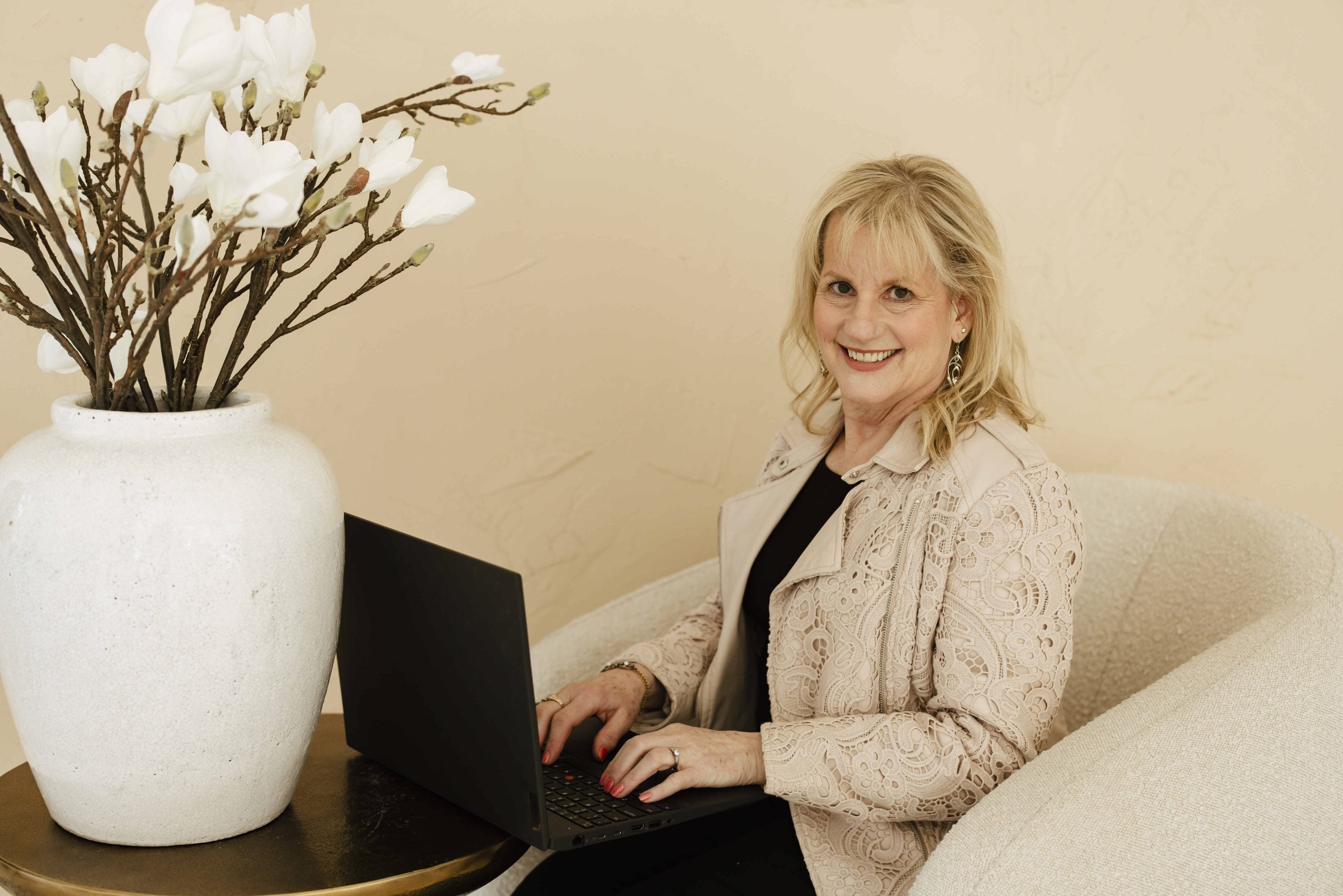 Karen Covy Mediator Karen Covy sitting at a laptop acting as a mediator.