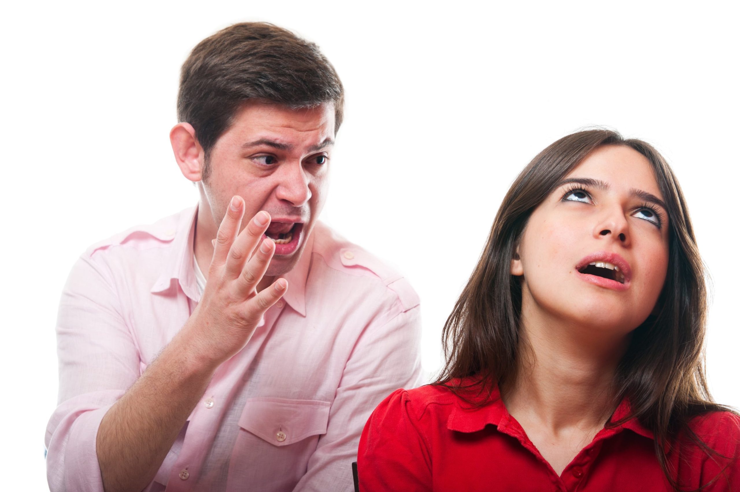 Man yelling at a woman who is rolling her eyes. They're having a difficult conversation.