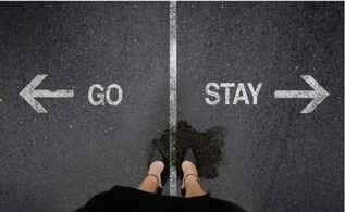 Woman's feet with a chalk line between them and the words "Go" and "Stay" pointing in opposite directions.