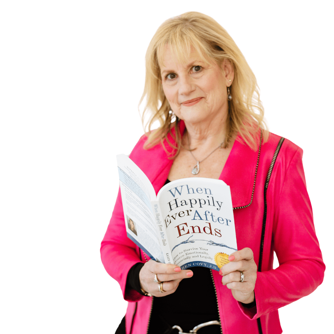 Karen Covy in a pink suit with her book "When Happily Ever After Ends"