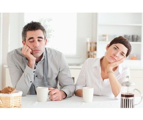Bored couple having coffee together.