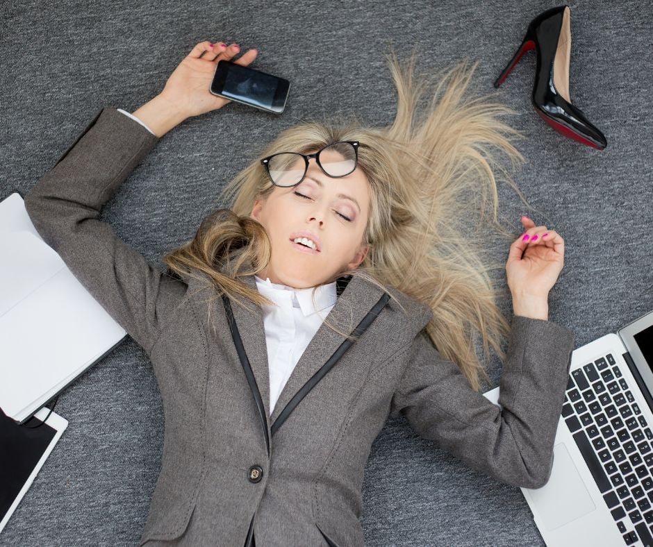 Talking too much Business woman passed out on the floor with her cell phone in her hand. Talkign too much.