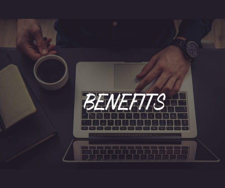 Benefits Hands on a laptop with the word "Benefits" over them.
