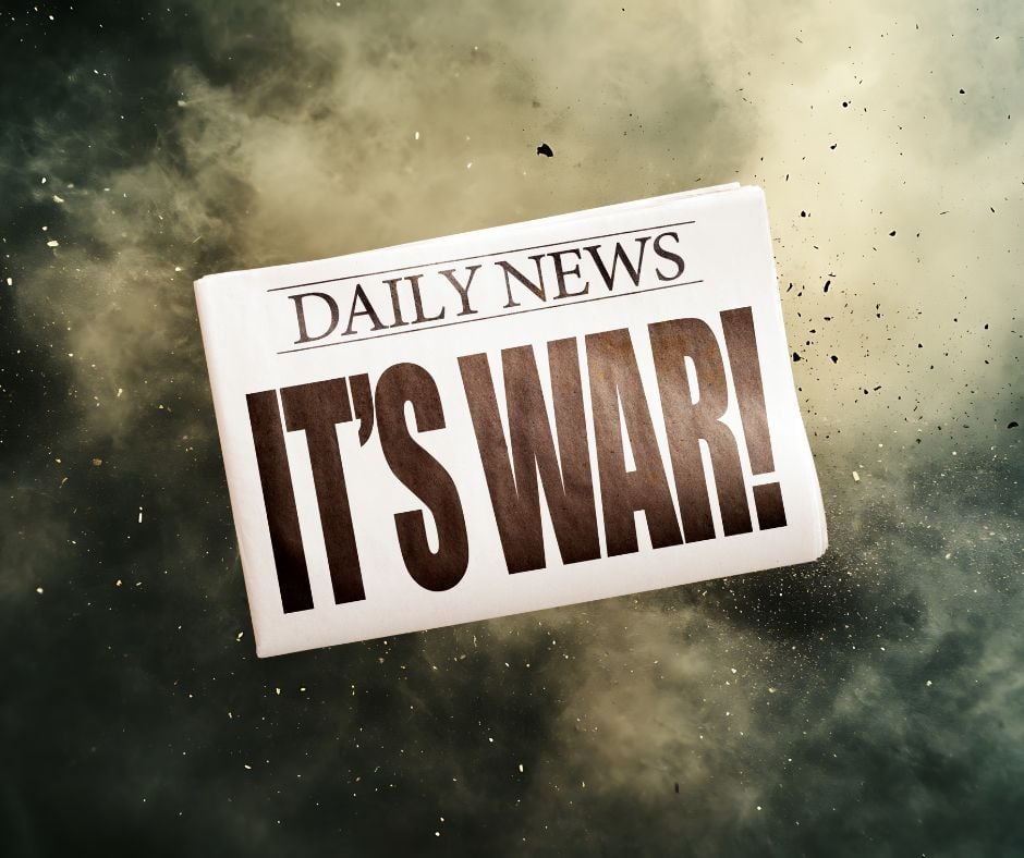 War News headline saying "It's War" over background of an ex[plosion.